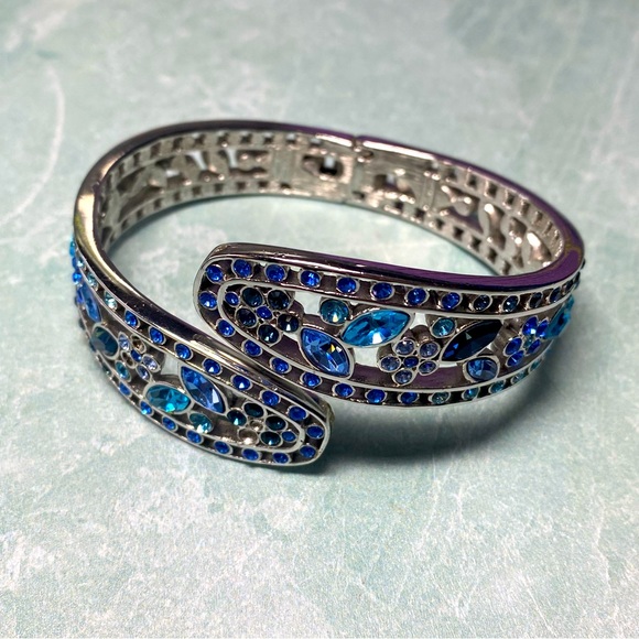 Nolan Miller Jewelry - Vintage Nolan Miller silver and blue stone hinged cuff bracelet missing stones